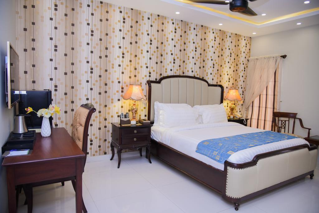 Orchards Cottage Hotel カラチ エクステリア 写真
